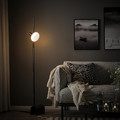 HÅRSLINGA / MOLNART Floor lamp with light bulb, black/donut-shaped opal white