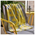 BRÄNNBOLL Throw, pale blue/bright yellow, 130x170 cm